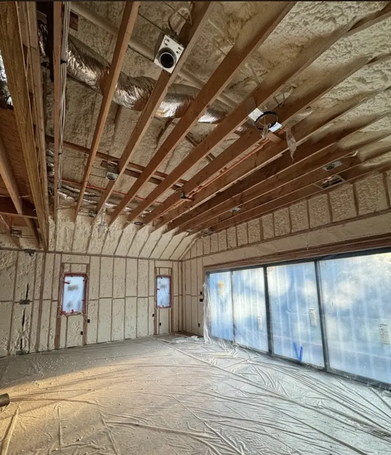 Interior walls and ceiling insulated with spray foam during new construction in Taos